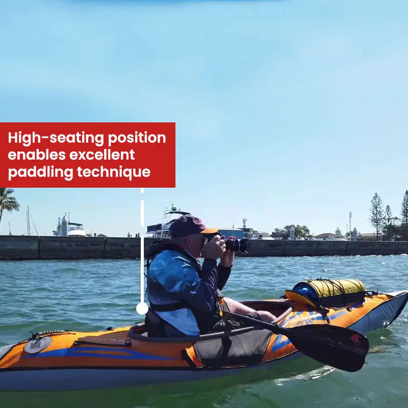 Man sitting inside the AdvancedFrame Sport Elite Kayak in high position