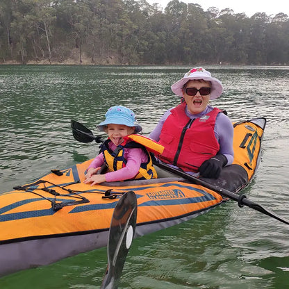 Woman with child smiling inside the AdvancedFrame Sport Elite Kayak 