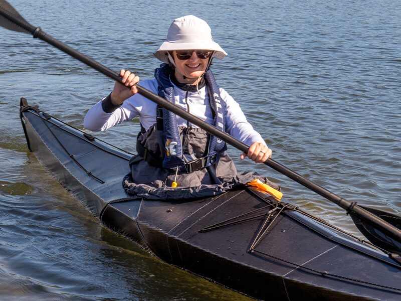 emily in oru kayak coast with spray skirt